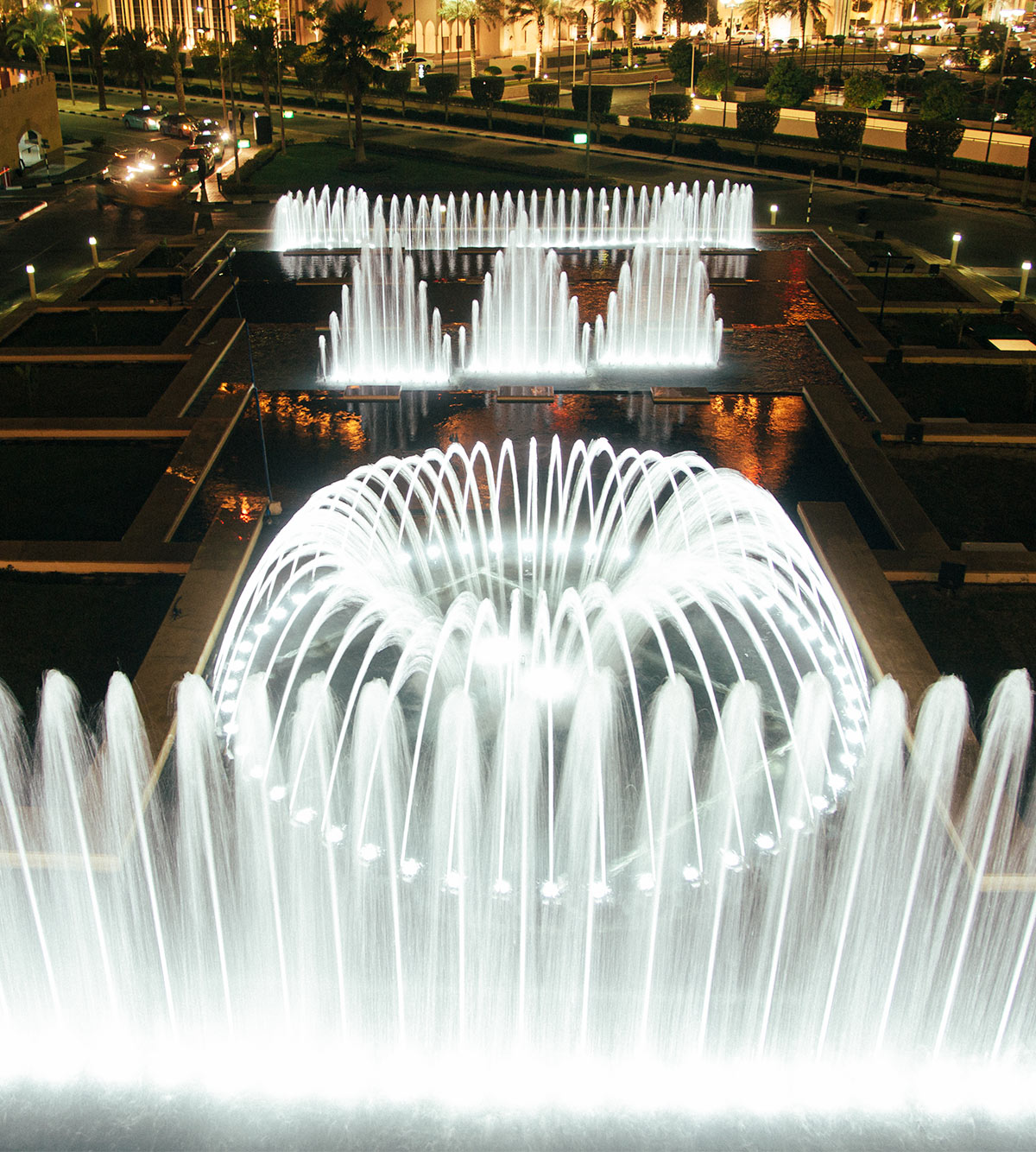 A custom musical fountain by Fontana fountains with various water feature components in a choreography.